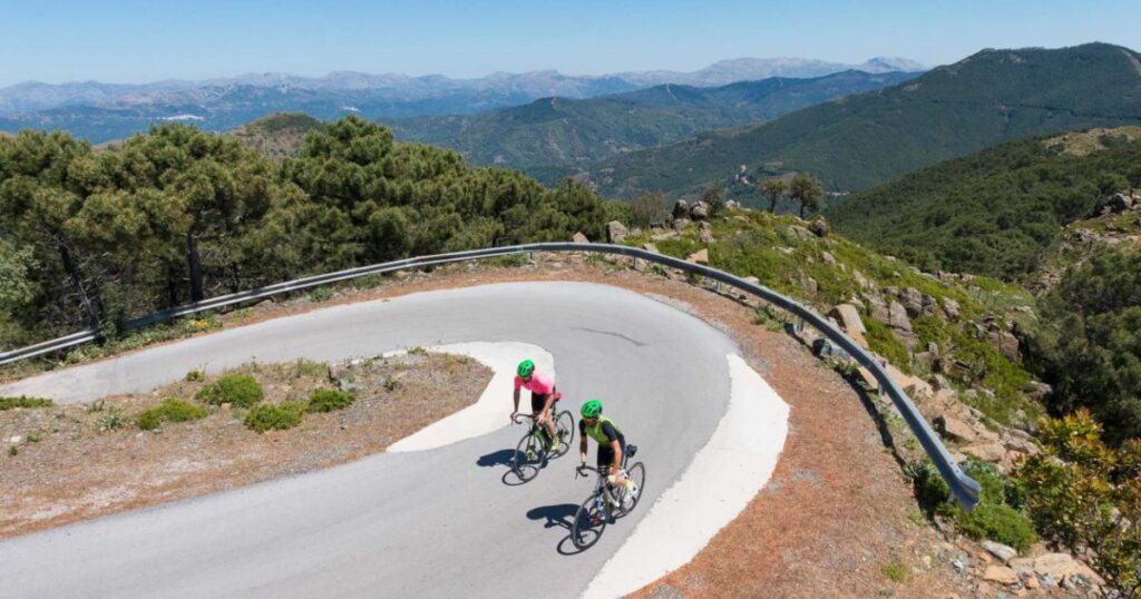 Road cyclists on a mountain hairpin above Marbella